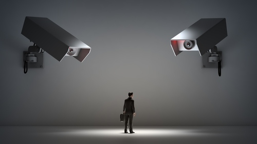 two video cameras monitoring employee; Big Brother concept